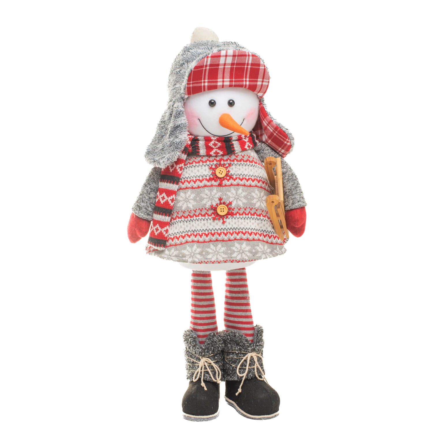 Bonhomme de neige suspendu en tricot rouge et gris descendant la colline avec toboggan